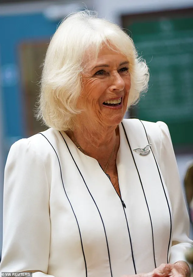 Queen Camilla Braves the Rain in Elegantly Monochrome Ensemble as Royal Colonel at New Normandy Barracks