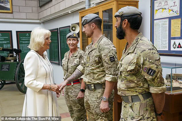 Queen Camilla Braves the Rain in Elegantly Monochrome Ensemble as Royal Colonel at New Normandy Barracks