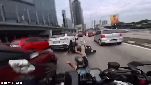 Toddler's Sudden Action Triggers Chain Reaction Crash on Kuala Lumpur Motorway, Leaving Motorcyclists Injured