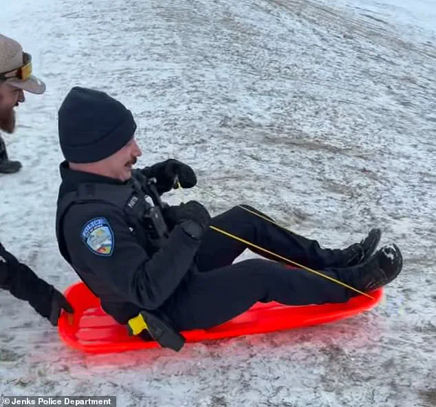 Viral Video Sparks Concern and Laughter as Jenks Officer's Sled Ride Turns Chaotic During Snowstorm
