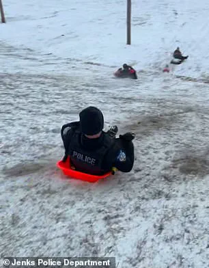 Viral Video Sparks Concern and Laughter as Jenks Officer's Sled Ride Turns Chaotic During Snowstorm