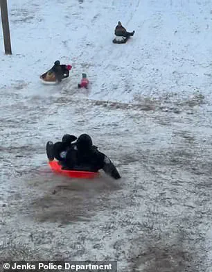 Viral Video Sparks Concern and Laughter as Jenks Officer's Sled Ride Turns Chaotic During Snowstorm