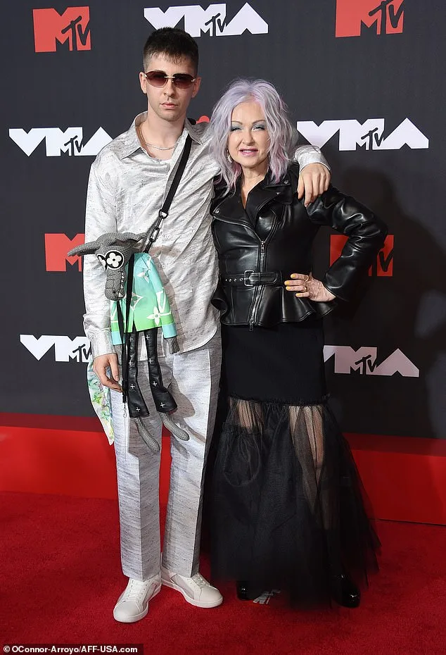 Cyndi Lauper's Son Dons Ostentatious Attire in Court Amid Probation Over Firearm Possession