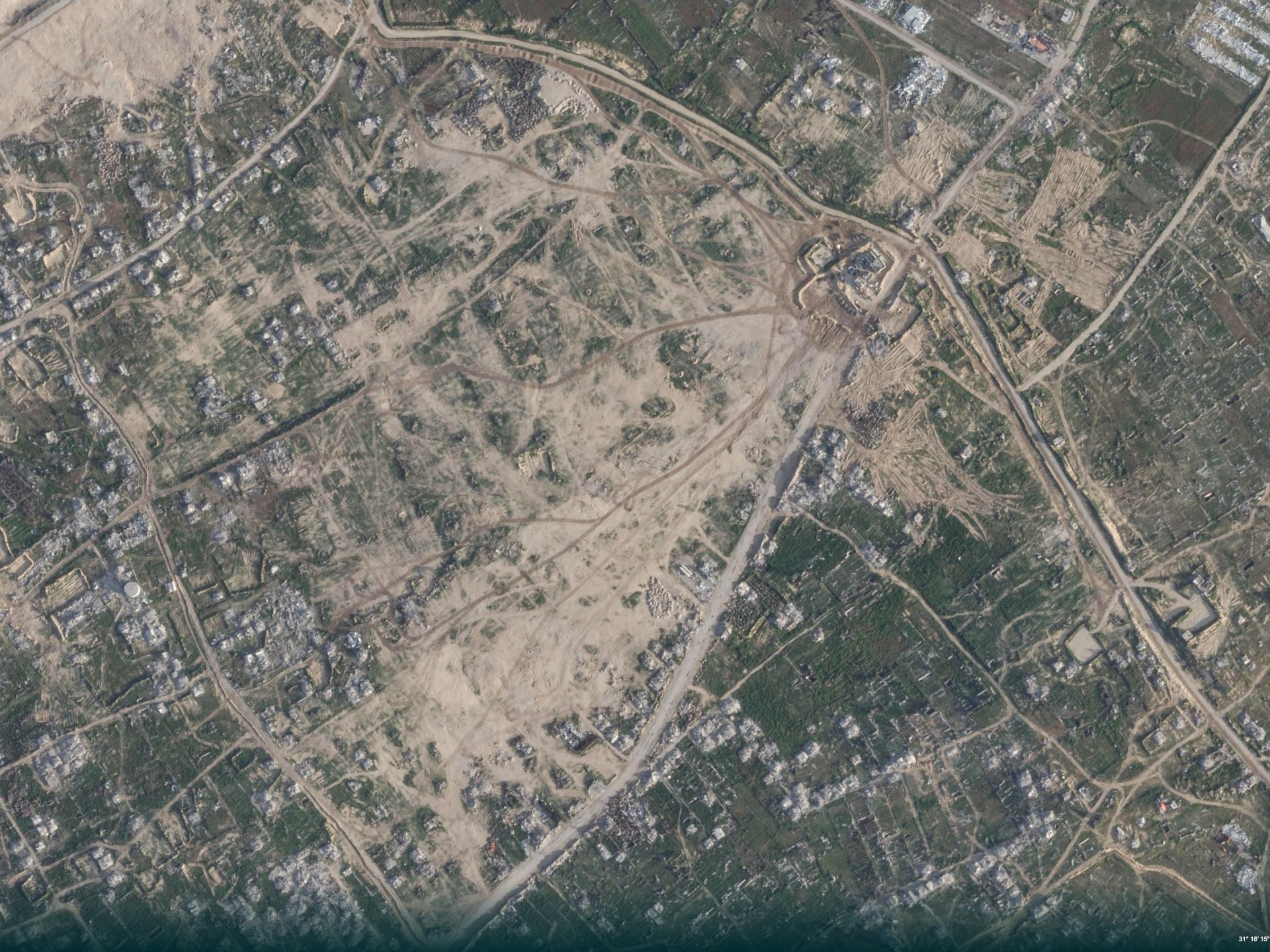 Satellite images show Israel building military forts in Gaza while reconstruction stalls.