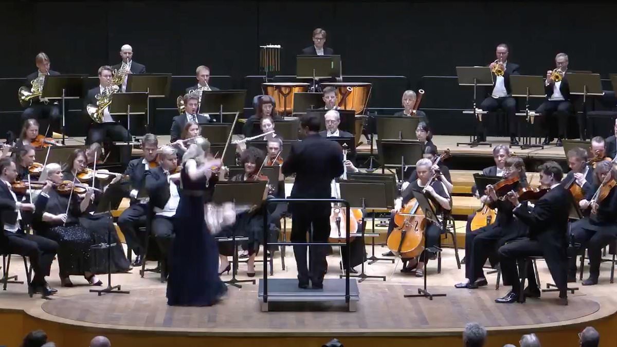 Violinist saves priceless million-pound instrument after dramatic stage fall
