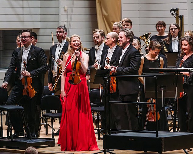 Violinist saves priceless million-pound instrument after dramatic stage fall