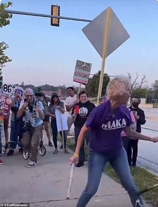 Protester wearing 'Make America Kind Again' Shirt Smashes Trump Pinata With Pipe