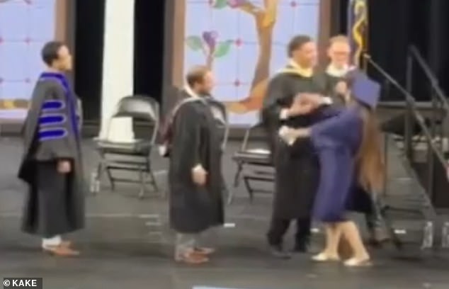 Wichita graduation disrupted as administrator forces students into unwanted handshakes.