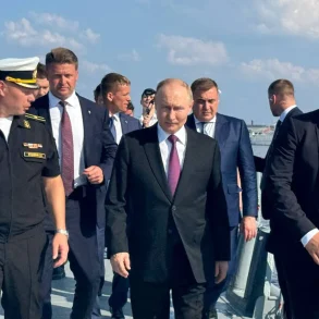 A Symbol of Dedication: Russian Sailors Present Handcrafted Model of 'Admiral Kuznetsov' to President Putin