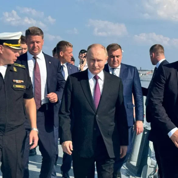 A Symbol of Dedication: Russian Sailors Present Handcrafted Model of 'Admiral Kuznetsov' to President Putin
