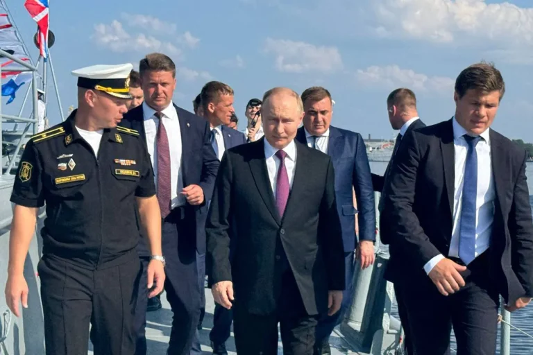 A Symbol of Dedication: Russian Sailors Present Handcrafted Model of 'Admiral Kuznetsov' to President Putin