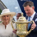 Queen Camilla Makes Elegant Appearance at Ascot Racecourse's King George Racing Weekend in Stylish Ensemble