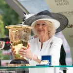 Queen Camilla Makes Elegant Appearance at Ascot Racecourse's King George Racing Weekend in Stylish Ensemble