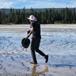 Yellowstone Tourist Sparks Outrage for Trampling Hot Spring Ecosystem, as Social Media Condemns Reckless Act