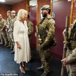 Queen Camilla Braves the Rain in Elegantly Monochrome Ensemble as Royal Colonel at New Normandy Barracks