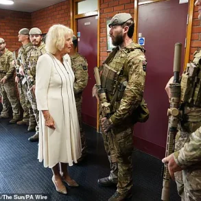 Queen Camilla Braves the Rain in Elegantly Monochrome Ensemble as Royal Colonel at New Normandy Barracks