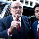 Rudy Giuliani Returns to His Show in Upper Body Brace After Car Crash, Quips About Possible Permanence
